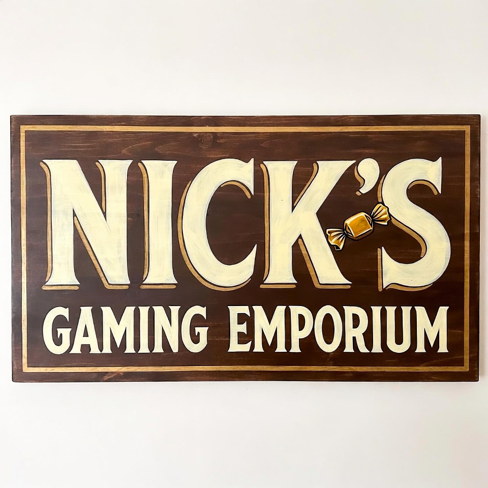 1986 — a hand-painted walnut sign reading NICK'S GAMING EMPORIUM, a butterscotch as the apostrophe